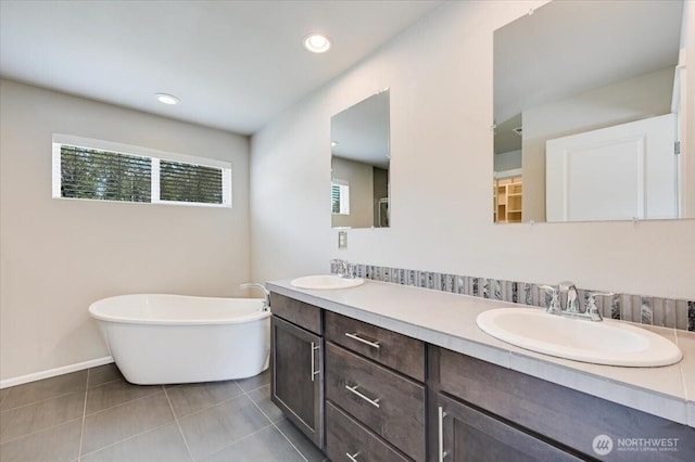 16311 5th Dr SE, Bothell, WA 98012 - full bath with double vanity, a freestanding bath, tile patterned floors, and recessed lighting