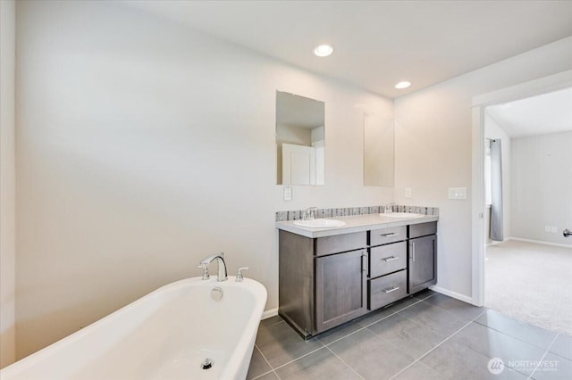 16311 5th Dr SE, Bothell, WA 98012 - full bathroom with a freestanding bath, double vanity, tile patterned flooring, and recessed lighting