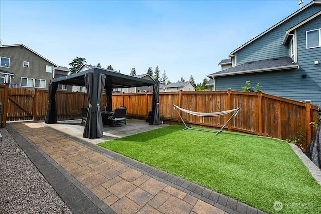 16311 5th Dr SE, Bothell, WA 98012 - fenced backyard featuring a gazebo and a patio area