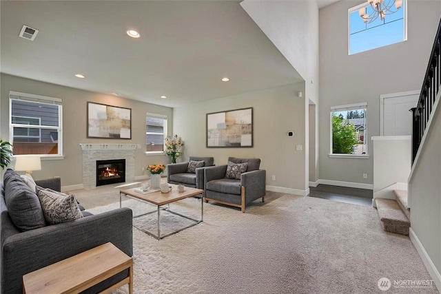 16311 5th Dr SE, Bothell, WA 98012 - living area with carpet floors, stairs, recessed lighting, a glass covered fireplace, and a chandelier