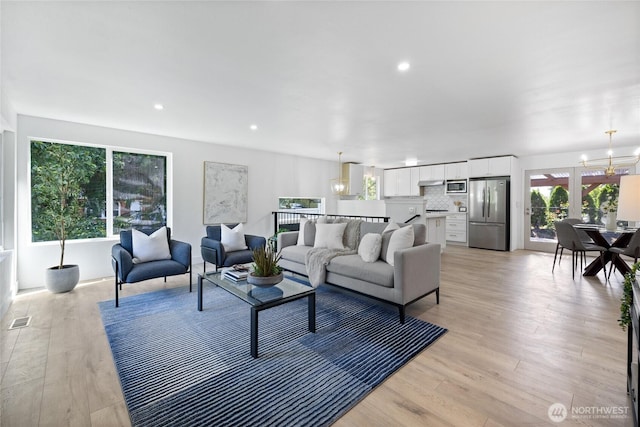 824 SW 301st Pl, Federal Way, WA 98023 - living area with a chandelier, light wood-style floors, and recessed lighting
