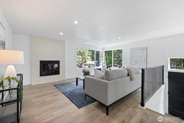 824 SW 301st Pl, Federal Way, WA 98023 - living room featuring light wood-style floors, recessed lighting, and a glass covered fireplace