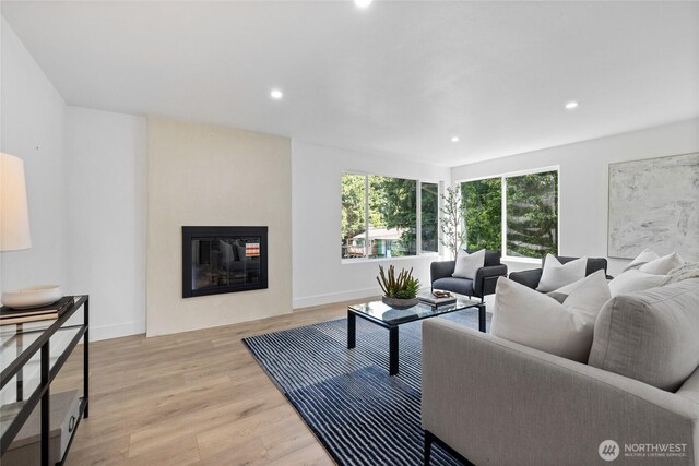 824 SW 301st Pl, Federal Way, WA 98023 - living room with light wood-type flooring, recessed lighting, and a glass covered fireplace