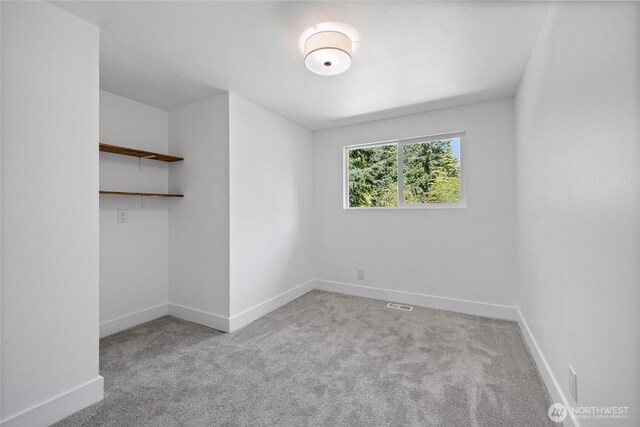 824 SW 301st Pl, Federal Way, WA 98023 - unfurnished bedroom with carpet floors and baseboards