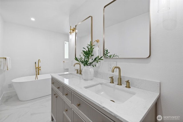 824 SW 301st Pl, Federal Way, WA 98023 - bathroom featuring double vanity, a freestanding bath, marble finish flooring, and recessed lighting