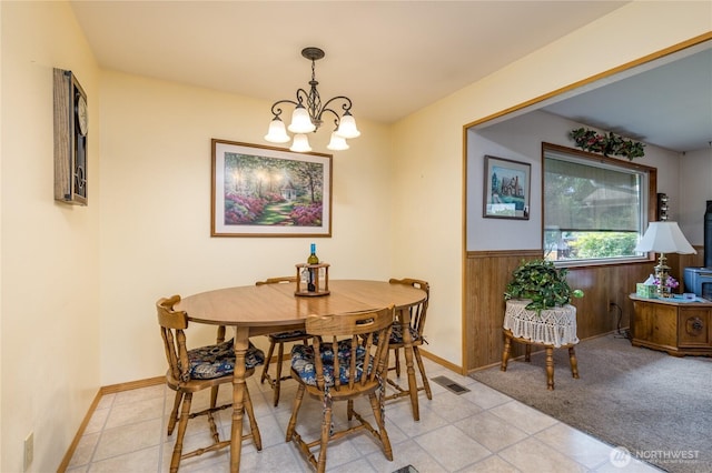 1023 E Maple St, Kent, WA 98030 - dining space featuring a chandelier, wainscoting, and light tile patterned floors