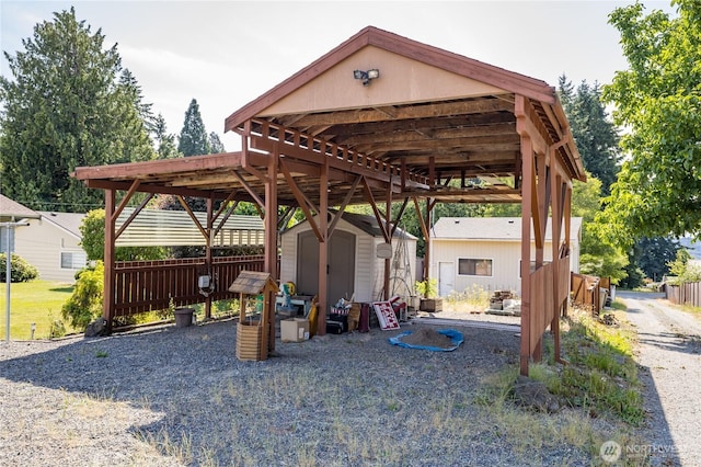 1023 E Maple St, Kent, WA 98030 - view of patio / terrace featuring a shed and a detached carport