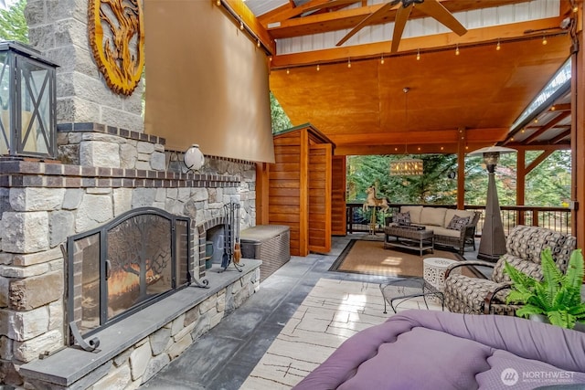 1546 Reservation Rd SE Unit 213, Olympia, WA 98513 - view of patio / terrace with an outdoor living space with a fireplace