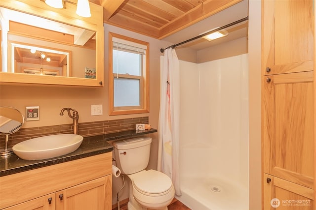 1546 Reservation Rd SE Unit 213, Olympia, WA 98513 - bathroom with decorative backsplash, vanity, wood ceiling, and curtained shower