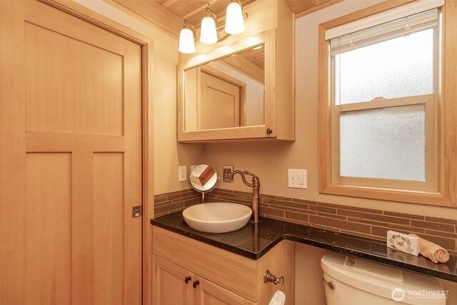 1546 Reservation Rd SE Unit 213, Olympia, WA 98513 - half bathroom featuring backsplash and vanity