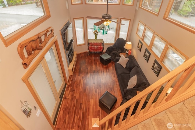 1546 Reservation Rd SE Unit 213, Olympia, WA 98513 - living area with a towering ceiling, wood finished floors, and ceiling fan