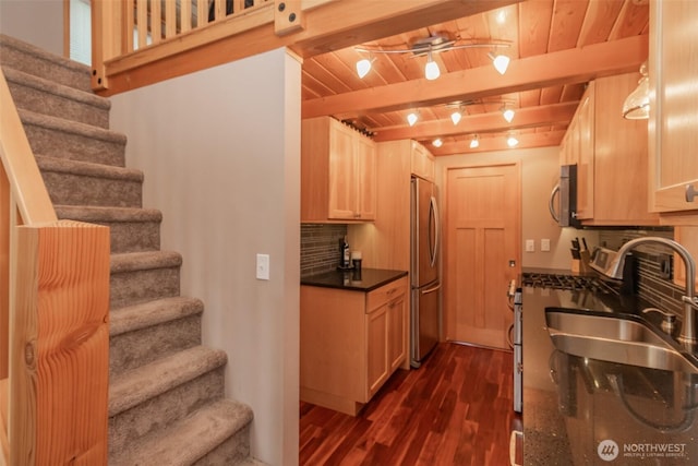 1546 Reservation Rd SE Unit 213, Olympia, WA 98513 - kitchen featuring dark wood finished floors, a wooden ceiling with exposed beams, stainless steel appliances, and tasteful backsplash