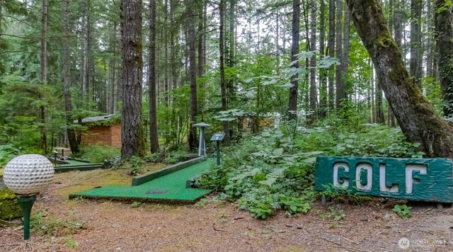 1546 Reservation Rd SE Unit 213, Olympia, WA 98513 - view of property's community featuring a putting green and a forest view