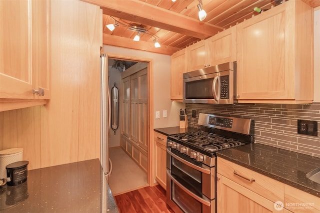 1546 Reservation Rd SE Unit 213, Olympia, WA 98513 - kitchen featuring stainless steel appliances, decorative backsplash, a wood ceiling with exposed beams, light brown cabinets, and dark stone countertops