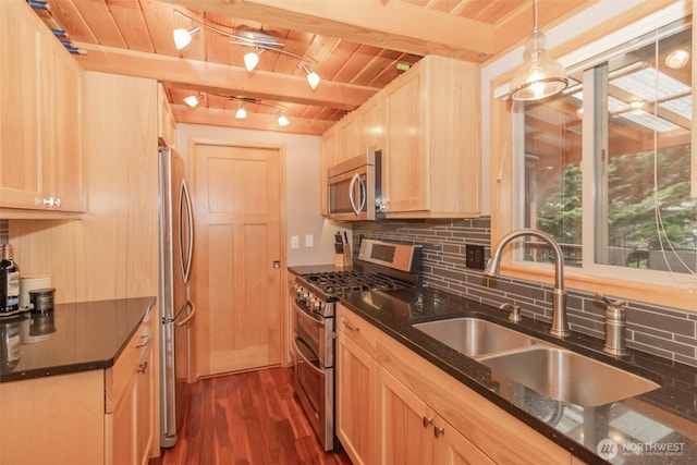 1546 Reservation Rd SE Unit 213, Olympia, WA 98513 - kitchen with stainless steel appliances, a wooden ceiling with exposed beams, decorative backsplash, dark wood finished floors, and dark stone counters