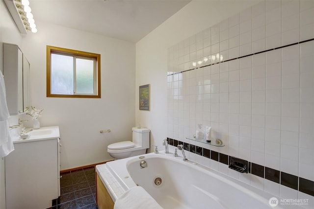 2433 E Valley St, Seattle, WA 98112 - bathroom with vanity, a tub with jets, and tile patterned flooring