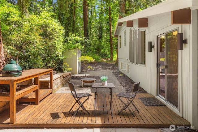 14460 NE 16th Pl, Bellevue, WA 98007 - wooden deck featuring an outdoor structure and outdoor dining area