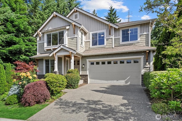 8132 NE 117th Pl, Kirkland, WA 98034 - craftsman-style home featuring a garage, driveway, and stone siding