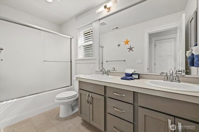 8132 NE 117th Pl, Kirkland, WA 98034 - bathroom with double vanity, tile patterned floors, and shower / bath combination with glass door