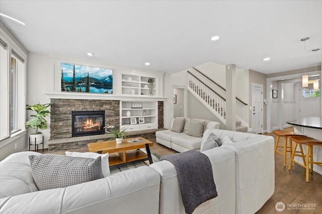 8132 NE 117th Pl, Kirkland, WA 98034 - living area featuring wood finished floors, stairway, a fireplace, and recessed lighting