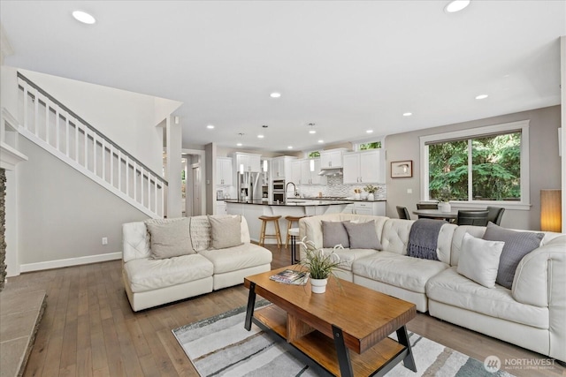 8132 NE 117th Pl, Kirkland, WA 98034 - living area with hardwood / wood-style flooring, stairway, and recessed lighting