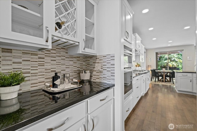 8132 NE 117th Pl, Kirkland, WA 98034 - kitchen featuring glass insert cabinets, white cabinetry, backsplash, and recessed lighting