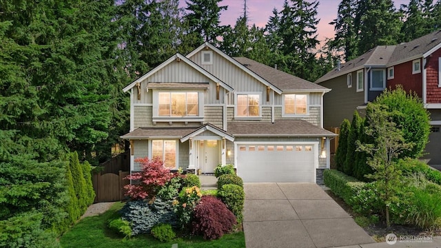 8132 NE 117th Pl, Kirkland, WA 98034 - craftsman-style house featuring a garage, driveway, and board and batten siding