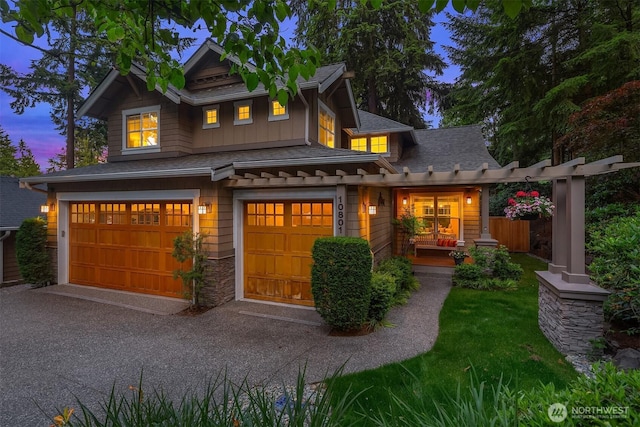 10801 SE 28th St, Bellevue, WA 98004 - craftsman-style house featuring an attached garage, roof with shingles, and asphalt driveway