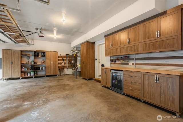10801 SE 28th St, Bellevue, WA 98004 - garage featuring beverage cooler, a garage door opener, and secured water heater