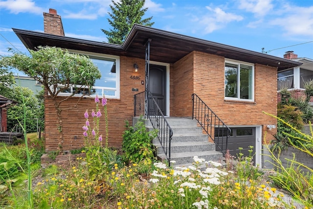 4886 24th Ave S, Seattle, WA 98108 - view of front of property with a chimney and brick siding