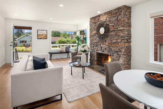4886 24th Ave S, Seattle, WA 98108 - living area featuring a fireplace, wood finished floors, and recessed lighting