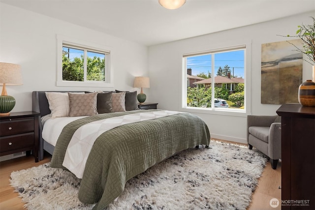 4886 24th Ave S, Seattle, WA 98108 - bedroom with multiple windows and wood finished floors