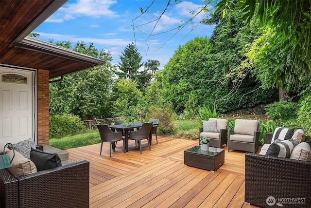 4886 24th Ave S, Seattle, WA 98108 - deck featuring outdoor lounge area, outdoor dining space, and view of wooded area