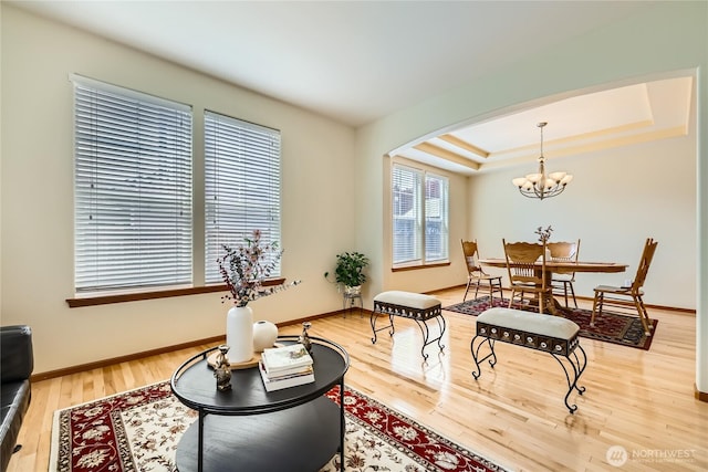 3205 179th Pl SE, Bothell, WA 98012 - sitting room with arched walkways, a chandelier, light wood-style floors, and a tray ceiling