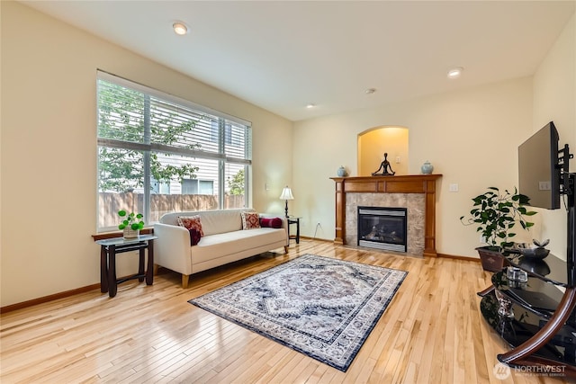 3205 179th Pl SE, Bothell, WA 98012 - living room featuring a tiled fireplace and wood-type flooring