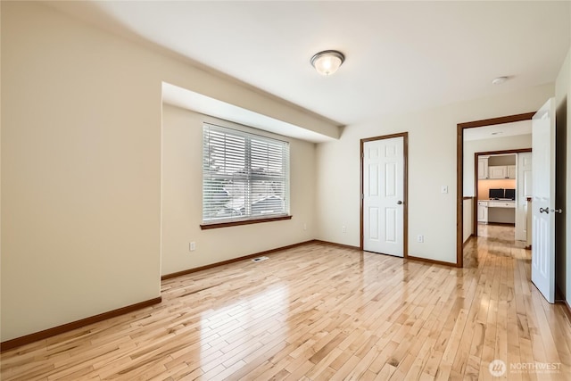 3205 179th Pl SE, Bothell, WA 98012 - unfurnished bedroom with light wood-type flooring and baseboards