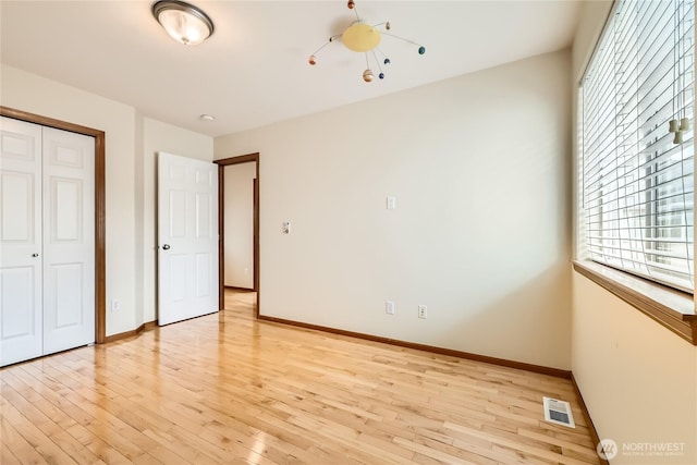 3205 179th Pl SE, Bothell, WA 98012 - unfurnished bedroom featuring light wood finished floors and a closet