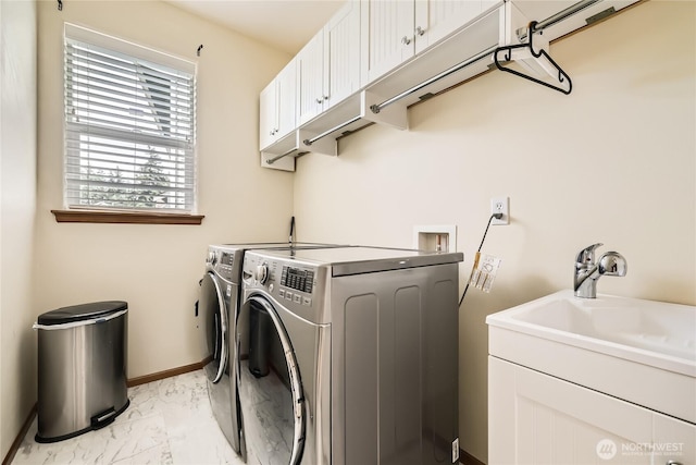 3205 179th Pl SE, Bothell, WA 98012 - laundry area with light marble finish floors, washer and clothes dryer, and cabinet space