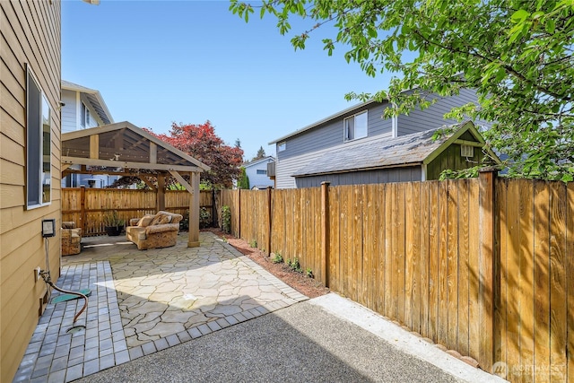 3205 179th Pl SE, Bothell, WA 98012 - fenced backyard featuring a patio area, a gazebo, and outdoor lounge area