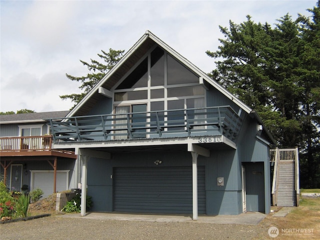 33610 J Pl, Ocean Park, WA 98640 - view of front of property with a garage, stairway, and a wooden deck