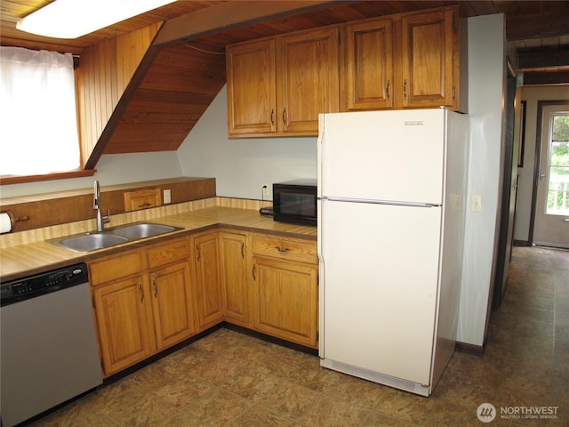 33610 J Pl, Ocean Park, WA 98640 - kitchen with freestanding refrigerator, dishwasher, tile countertops, and brown cabinetry
