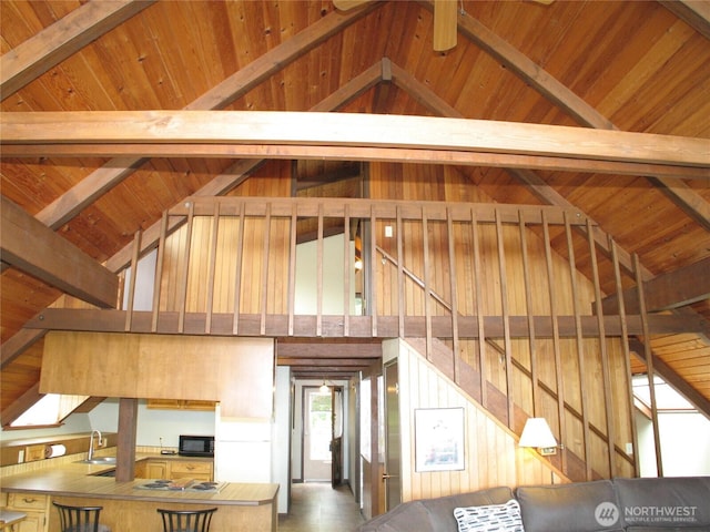 33610 J Pl, Ocean Park, WA 98640 - unfurnished living room featuring a wooden ceiling with exposed beams, high vaulted ceiling, and stairway