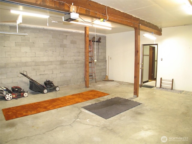 33610 J Pl, Ocean Park, WA 98640 - garage featuring a garage door opener and concrete block wall
