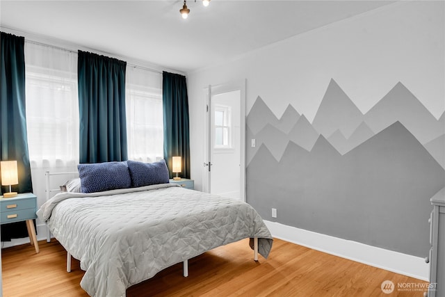 1916 11th Ave W, Seattle, WA 98119 - bedroom with light wood-style flooring and baseboards