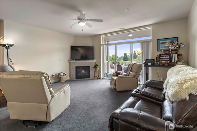 1548 River Rd Unit 301, Longview, WA 98632 - living area featuring ceiling fan, carpet flooring, and a tiled fireplace