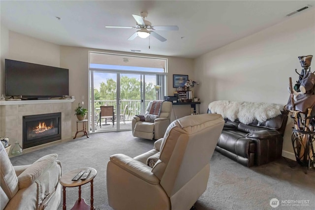 1548 River Rd Unit 301, Longview, WA 98632 - living area with carpet flooring, ceiling fan, and a tile fireplace