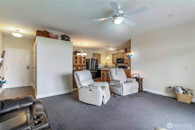 1548 River Rd Unit 301, Longview, WA 98632 - living room featuring ceiling fan, a chandelier, and dark colored carpet