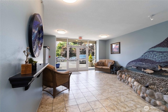 1548 River Rd Unit 301, Longview, WA 98632 - tiled bedroom featuring access to outside, french doors, and expansive windows
