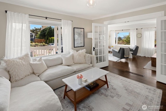 4106 SW Kenyon St, Seattle, WA 98136 - living area with french doors, wood finished floors, crown molding, and healthy amount of natural light