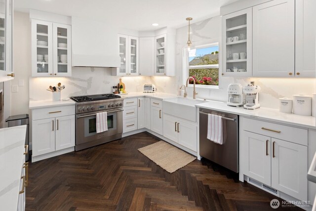 4106 SW Kenyon St, Seattle, WA 98136 - kitchen with appliances with stainless steel finishes, recessed lighting, white cabinetry, light countertops, and tasteful backsplash